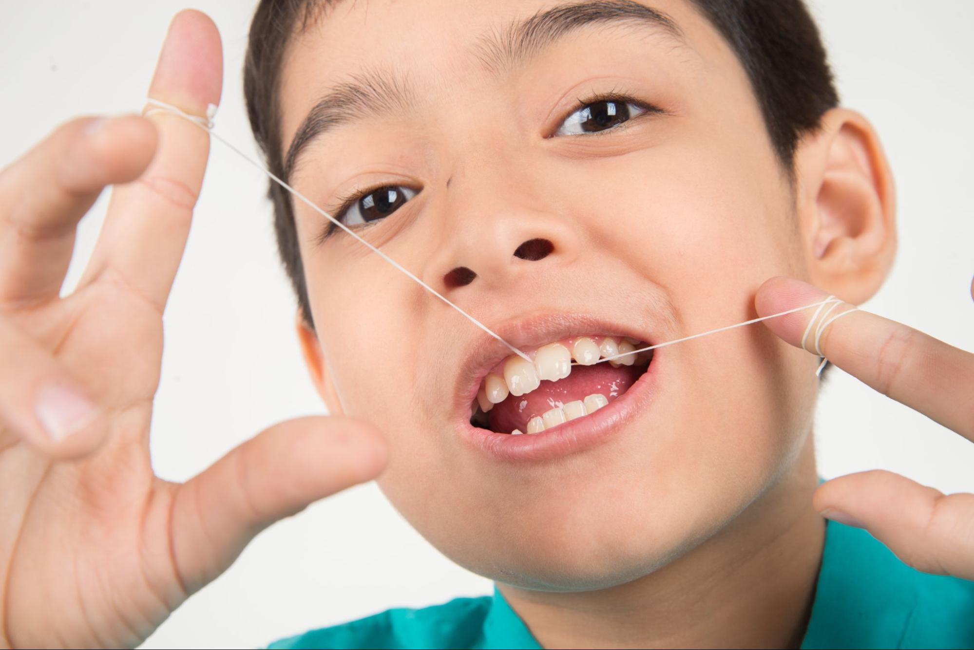 How Parents Can Help Kids Floss